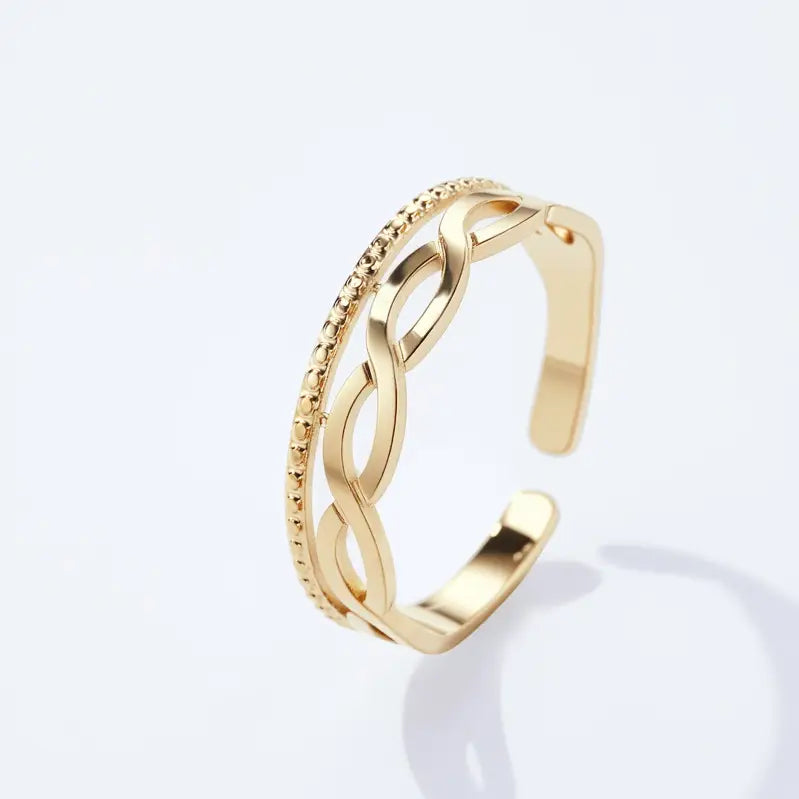 Liora Handschmuck Edelstahlring mit Flechtmuster (Goldfarben)